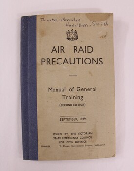 A blue and beige booklet with black text on front cover 