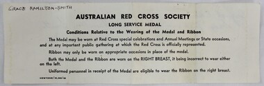 A block of black text printed on white paper instructing on correct wear of medal 