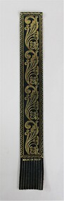 A deep forest green bookmark with gold embossing 
