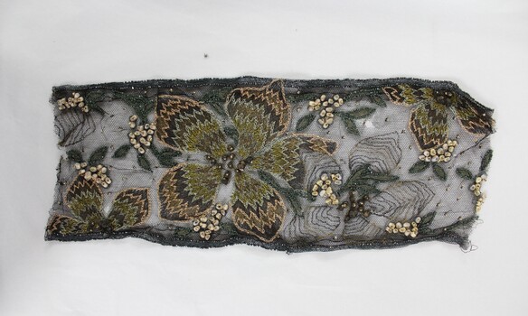 Bronze and gold embroidery and bead work on black mesh 