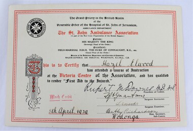 A printed certificate with black text and red bordering, and hand written inscriptions