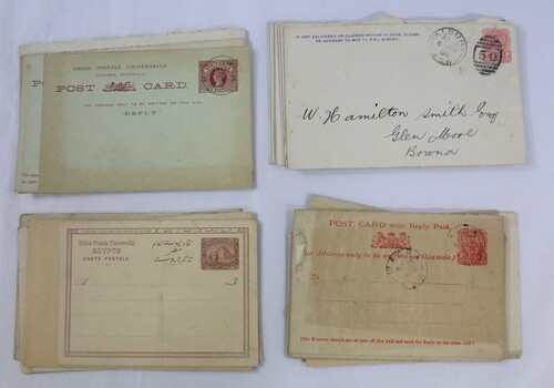 Four stacks of used envelops and postcards 