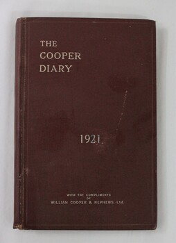 A small burgundy leather diary with silver embossing 