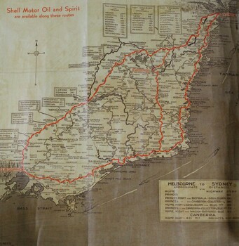 A brown and tan high way map with red road markings. 