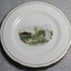 A white plate with gold trim. A hand painted image depicting Woodland Grove, Wodonga is in the centre.