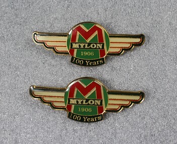 Badges produced to celebrate the centenary of Mylon in 1906. Company logo including 1906 and 100 years