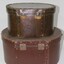 Reverse of two brown hat boxes
