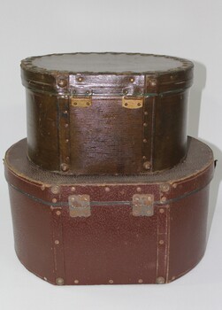 Reverse of two brown hat boxes