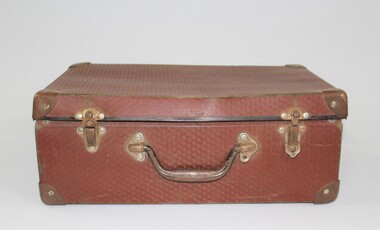 Brown vinyl suitcase with metal latch, pictured closed 