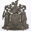 Metal shield for the Victorian State Government offices. The kangaroo at the top holds a crown. The shield also features the Southern Cross