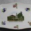 An oblong china dish. White with floral emblems and image of Soldiers Memorial, Wodonga