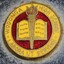 Yellow, red and gold painted circular logo including an open book and a torch