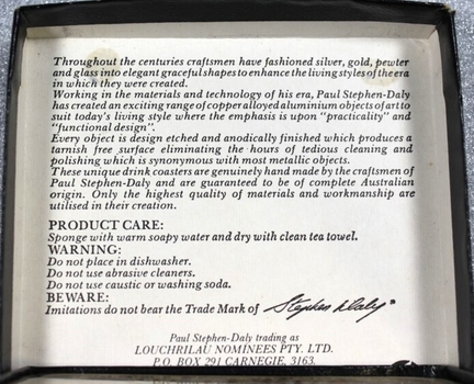 Inside of coaster box showing information about Paul-Stephen Daly craftsmen and care instructions