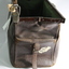 Open Gladstone bag end view showing metal hinge