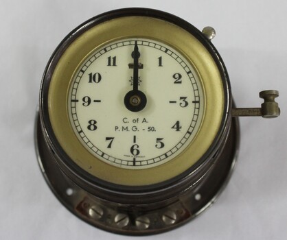 Small clock used By the PMG at the Wodonga Telephone Exchange to time calls. Timing switch on side.