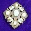 Front of Vintage Sarah Coventry large silver tone brooch with turquoise coloured and faux pearl stone 