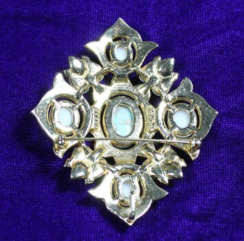  Back of Vintage Sarah Coventry large silver tone brooch with turquoise colored and faux pearl stone 