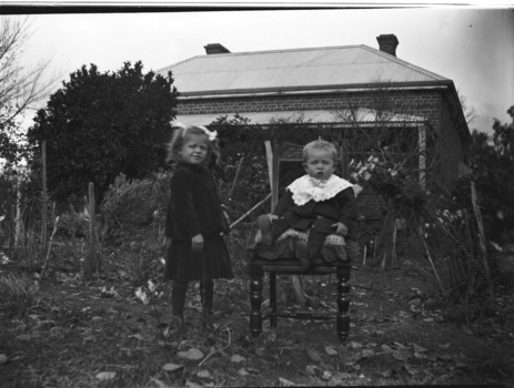 Image of Margery Children with house in the background