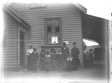 Nellie Haeusler and J. Mann with a group of Sunday School children