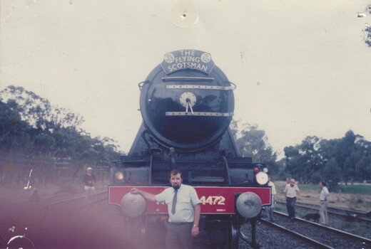 Guard Colin Ray standing in front of The Flying Scotsman