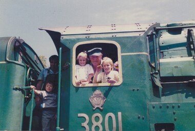 2 locomotive drivers and 3 young children on the locomotive 3801