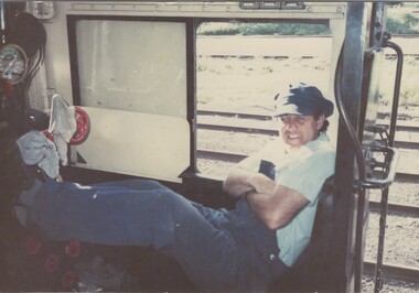 Driver Mick Mathews inside cabin of R761 Locomotive
