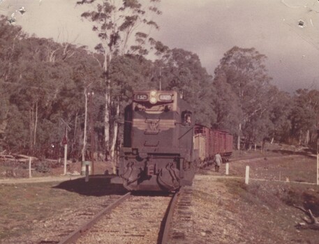 Engine Instructor walking beside Locomotive T329
