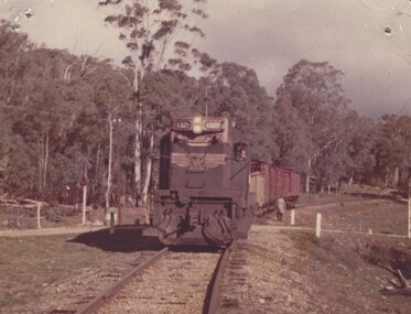 Engine Instructor walking beside Locomotive T329