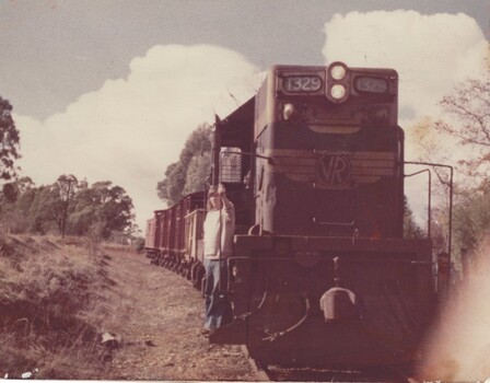 Fireman Ian Sandford on step of locomotive