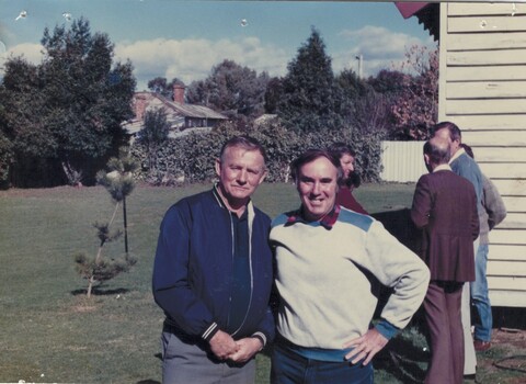 Tom Symonds and Mick Bergin with  other people in the background.