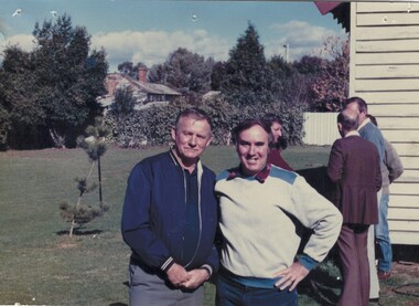 Tom Symonds and Mick Bergin with  other people in the background.