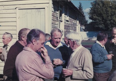 A large group of men in conversation