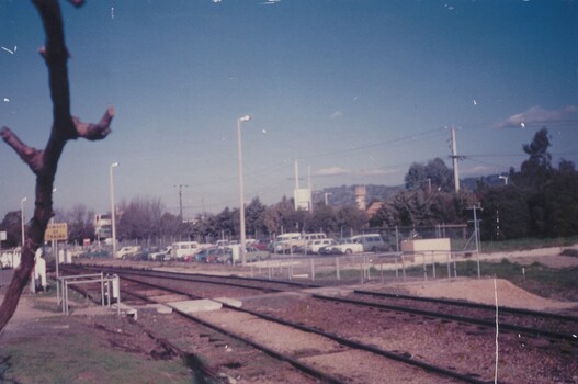 Employees' car park at Wodonga Railway Yards with train tracks in the foreground.