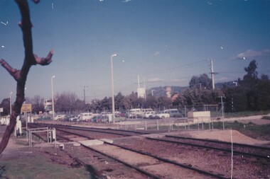 Employees' car park at Wodonga Railway Yards with train tracks in the foreground.