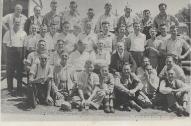 Group of men photographed at a retirement function.