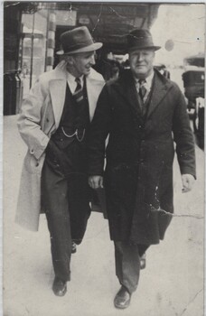 Jack Dwyer and Harry Dwyer walking along station platform.