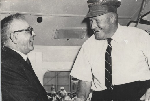 Harry Binder shaking hands with Commissioner Edgar Brownbill