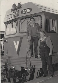 Driver Tom Symonds and Fireman Billy Hyde  standing on the front of Locomotive G516