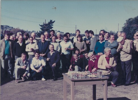 Group of men at send-off for two railway workers