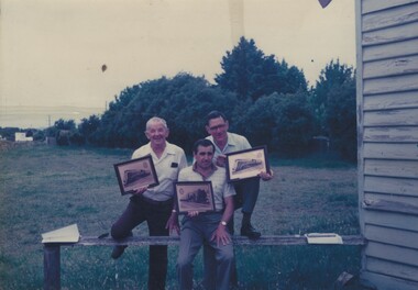  Len Gregson, Bill McAnanly and David Provan holding their retirement plaques.