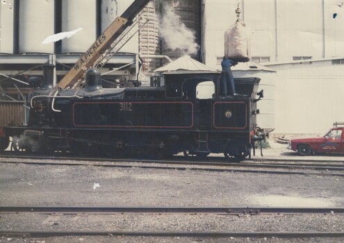 Locomotive 3112 filling up at railway siding in Albury