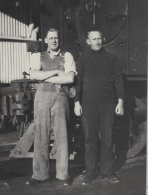  Fireman HEC Lloyd and Driver George Padgett standing beside locomotive