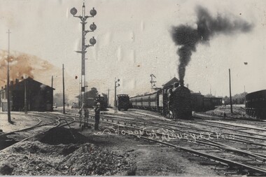 Express Steam Locomotive passing through railway yards at Wodonga