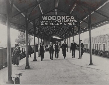 6 Railway men walking along the Wodonga Station platform.