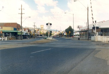 High Street Wodonga looking south from the railway crossing.  Railway boom gate on right.