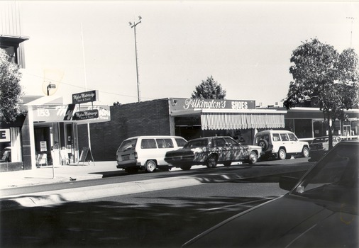 High street location of Mylon Motorways and Pilkington shoes on the right