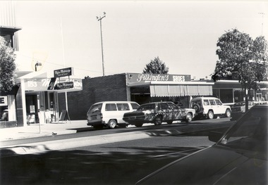 High street location of Mylon Motorways and Pilkington shoes on the right