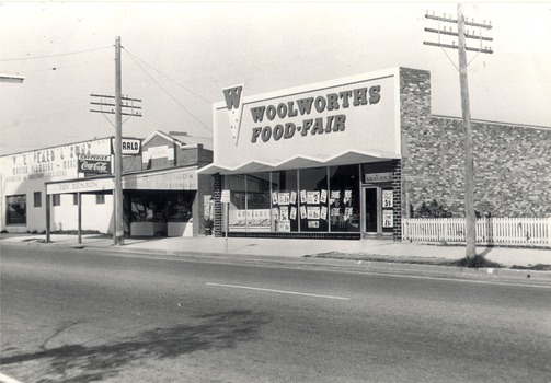 High Street West from Lawrence Street - V.R. Peard & Sons Plumbers; Roy Benson Stores; Woolworths Supermarket