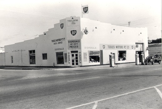 Tooles Motors High Street, Wodonga with petrol bowsers on the street.