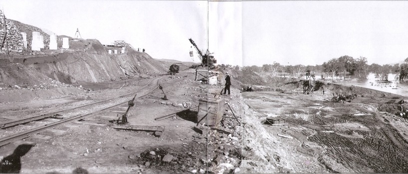 Exccavation of oulet and spillway. Workers in centre and to the right of image.